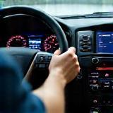 Technician using diagnostic tools on dashboard