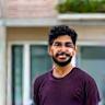 Nikhil P. smiling outside the shop